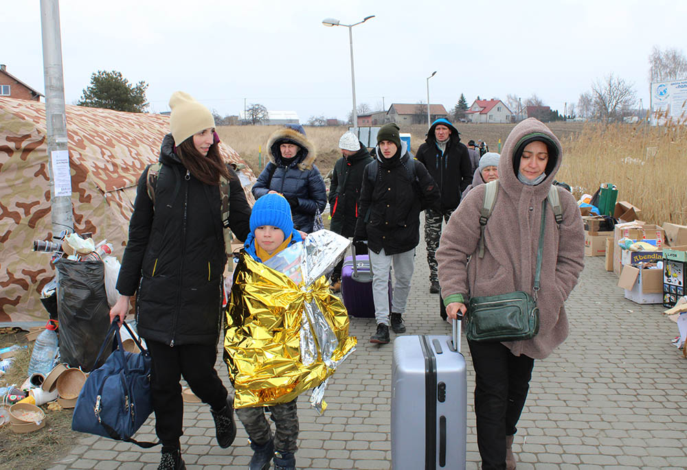 On Polish border, Ukraine refugees ache for home while facing uncertain